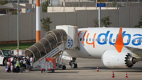 Passengers embark on a FlyDubai aircraft at Ben Gurion International Airport, near Tel Aviv, Israel, Wednesday, Sept. 30, 2026.
