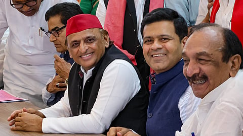 Samajwadi Party (SP) President Akhilesh Yadav flanked by party candidates Professor Ram Gopal Yadav, second left, and Dhanraj Parimal Nathwani, second right, who filed their nomination papers for the upcoming Rajya Sabha elections from Uttar Pradesh, in Lucknow, Wednesday, Sept. 30, 2026. Samajwadi Party MLA Shivpal Singh Yadav, left, is also seen.