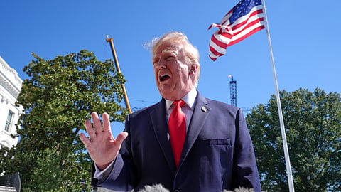 US President Donald Trump speaks with reporters before boarding Marine One on the South Lawn of the White House, Thursday, Oct. 1, 2026, in Washington.