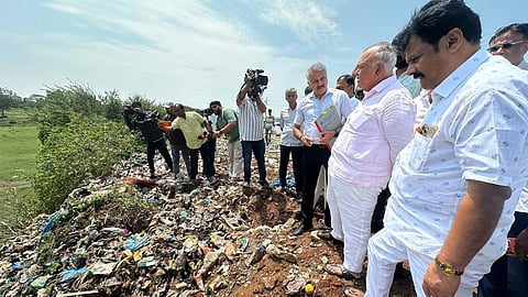 Forest Minister Ramalinga Reddy inspects a lake in Anekal on Wednesday.