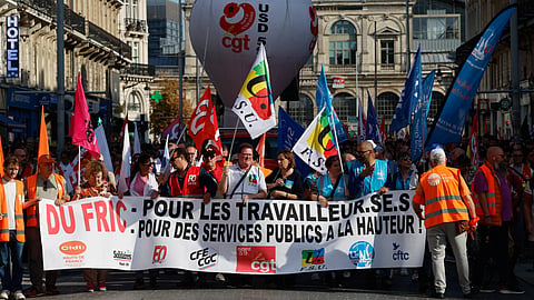 Protesters march against the government's release of next year's draft budget, in Lille, France, Tuesday, Sept. 29, 2026.