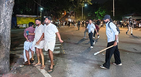 Police personnel use batons to disperse students during a clash between SFI and KSU workers near the Stone Throne at Palayam in Thiruvananthapuram. Police also used tear gas and resorted to a lathi charge near the Mens Hostel of the University of Kerala amid the confrontation.