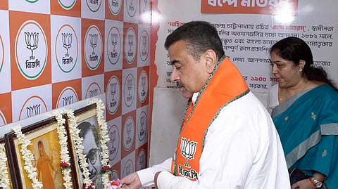 In this photo from Sept. 29, 2026, West Bengal Chief Minister Suvendu Adhikari offers floral tributes at the portraits of Bharat Mata and Syama Prasad Mookerjee at the BJP state headquarters in Kolkata on Tuesday.