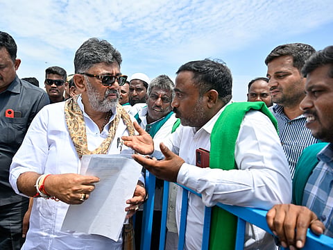 Farmers submit a memorandum to Chief Minister DK Shivakumar during his visit to Kollegal taluk in Chamarajanagar district on Wednesday.