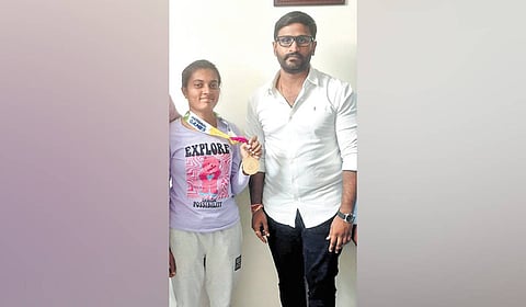 Government Whip Balmoor Venkat congratulates Taniparthi Chikitarao for winning gold medals at the Asiad.