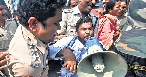 Police clearing the protesters at Master Canteen square in Bhubaneswar on Wednesday.