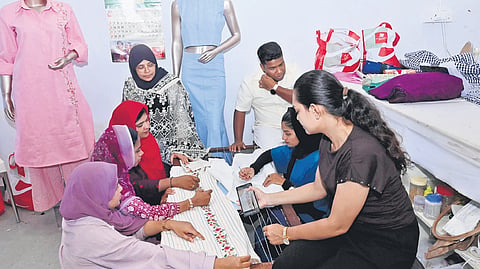 Designers work on intricate khadi attire, creating varied designs and contemporary styles ahead of the upcoming Malabar Fashion Week 
in Kozhikode
