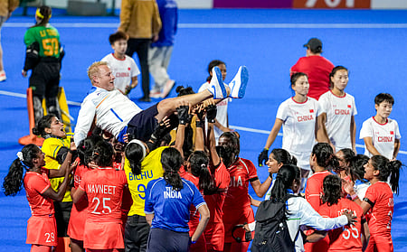 India players lift coach Sjoerd Marijne after winning the Asian Games gold medal in Japan