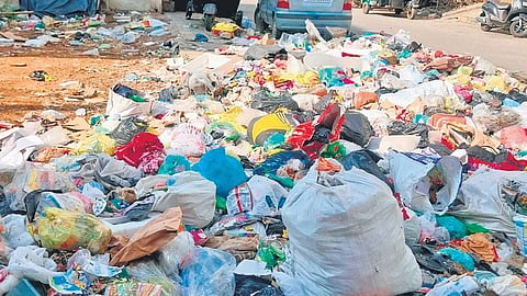 Garbage dumped on the roadside in Banashankari Temple Road ward. Officials have warned the contractor to clear the waste regularly or the contract will be terminated.