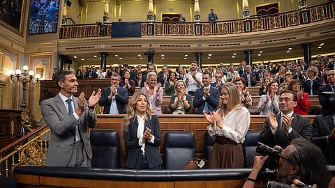 Spanish Prime Minister Pedro Sánchez, left, applauds at the Spanish parliament in Madrid, Friday, Oct. 2, 2026.