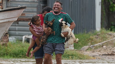 People evacuate their homes as Hurricane Polo approaches Puerto San Carlos, Baja California Sur state, Mexico, Monday, Sept. 28, 2026. 