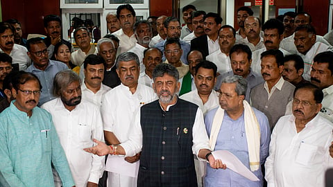 CM DK Shivakumar, along with members of his cabinet and party leaders, addresses the media outside the CEO Karnataka office in Bengaluru on Thursday.