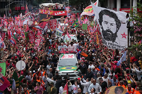 Brazilian President Luiz Inacio Lula da Silva, who is running for reelection, center, accompanied by Senate candidates Benedita da Silva, right, and Pedro Paulo, attends a campaign rally in Rio de Janeiro, Brazil, Friday, Oct. 2, 2026.