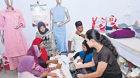 Designers work on intricate khadi attire, creating varied designs and contemporary styles ahead of the upcoming Malabar Fashion Week 
in Kozhikode