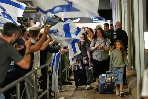 Israeli passengers who had been aboard a FlyDubai aircraft that made an emergency landing in Saudi Arabia are welcomed at the arrivals gate at Ben Gurion International Airport near Tel Aviv, Israel, Wednesday, Sept. 30, 2026.