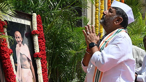 Chief Minister DK Shivakumar pays tributes to Mahatma Gandhi on 157th Gandhi Jayanti on the premises of Vidhana Soudha in Bengaluru on Friday  