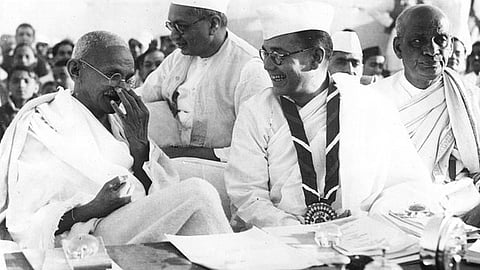 Gandhi at the Indian National Congress annual meeting in Haripura in 1938. Congress President Subhas Chandra Bose is wearing the ribbon, seated behind him is Dr Rajendra Prasad, and to the right of Bose is Sardar Vallabhbhai Patel