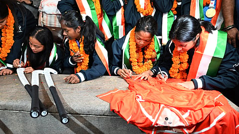 Members of the women's hockey team at the Bengaluru airport on Sunday