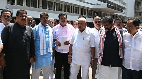 Former CM BS Yediyurappa, party state president BY Vijayendra and other BJP leaders at the office of the DG & IGP in Bengaluru on Saturday.