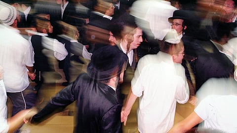 Lively Simchat Torah processions dancing with the Torah scrolls in Tel Aviv 