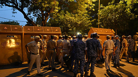 Police personnel block a road with barricades, ahead of the Cockroach Janata Party's (CJP) protest march, at the Jantar Mantar, in New Delhi