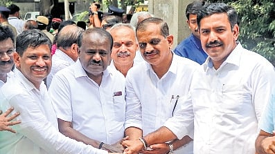 NDA candidates AP Ranganath (left) and KM Suresh (second from right) greet Union Minister HD Kumaraswamy and state BJP chief BY Vijayendra at the Regional Commissioner’s Office, Shantinagar, before submitting their nomination papers for the upcoming MLC polls, in Bengaluru on Monday.