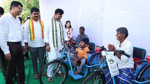 Union Minister Ram Mohan Naidu distributes tricycles, wheelchairs in AP's Srikakulam.