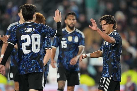 Argentina's Giuliano Simeone, right, celebrates with teammates after scoring his side's seventh goal against Burkina Faso during an international friendly soccer match in Buenos Aires, Argentina, Saturday, Oct. 3, 2026. 