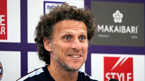 Diego Forlan reacts during the press conference on Monday