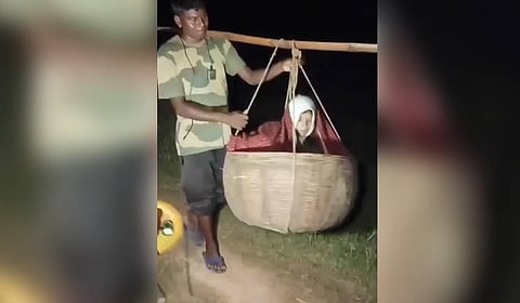 Pregnant woman carried on 'bahangi' as damaged road prevents ambulance from reaching Jharkhand village.
