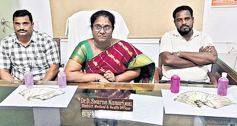 Ranga Reddy DMHO, health inspector and the driver with the tainted amount.