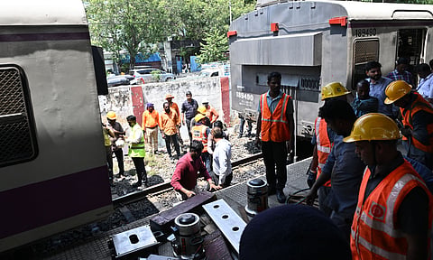 Technicians carrying out restoration work after a suburban train derailed at the Chennai Fort railway station on Monday  