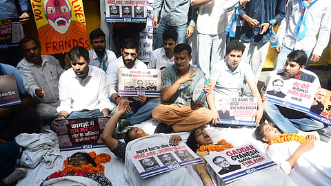 NSUI staging a symbolic protest at Jantar Mantar on Monday.
