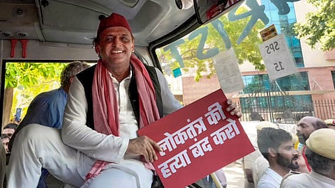 Samajwadi Party Chief Akhilesh Yadav inside a police bus after being detained by security personnel during an INDIA bloc protest march towards the Election Commission of India (ECI) office, demanding the resignation of Chief Election Commissioner Gyanesh Kumar, in New Delhi, Tuesday, Oct. 6, 2026.
