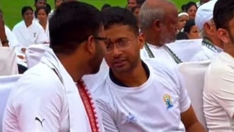 File photo of Panposh sub-collector Chandrakant Mallick (right) with Prakash Paswan.