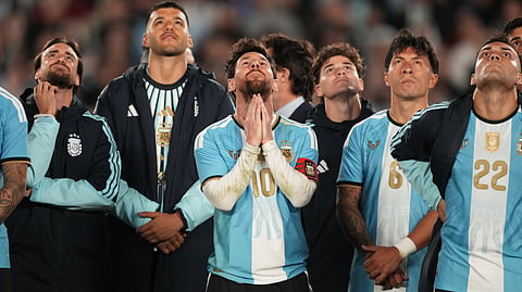 Argentina's Lionel Messi and teammates watch a drone show at the end of his final match for the national team, a soccer friendly against Benin, in Buenos Aires, Argentina, Tuesday, Oct.6, 2026.