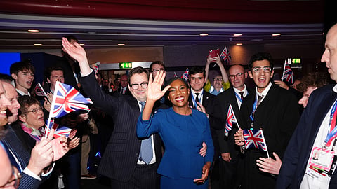 Conservative Party leader Kemi Badenoch with her husband, Hamish Badenoch, leave the stage after delivering her keynote speech during the Conservative Party conference at the International Convention Centre, Birmingham, England, Wednesday, Oct. 7, 2026.