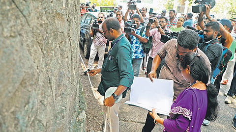 Revenue officials undertaking a survey of the land belonging to Kerala University, on the directions of the High Court, on Tuesday.