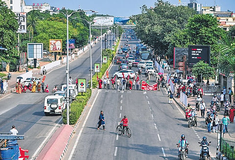 Agitators block the Jayadev Vihar-Nandankanan road during the 12-hour Odisha Bandh, in Bhubaneswar on Thursday