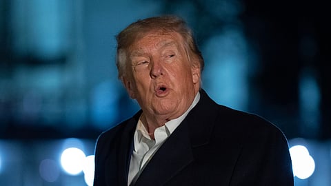 US President Donald Trump talks to reporters as he walks on the South Lawn upon his arrival to the White House, Thursday, Oct. 8, 2026, in Washington.