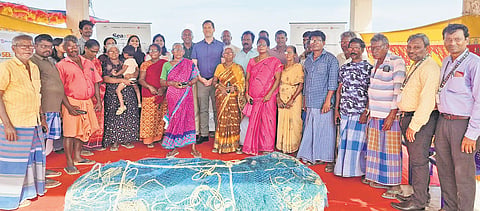 Head of Bureau of France in Chennai Christophe Bramoullé with members of the fishing community at Kottivakkam on Thursday