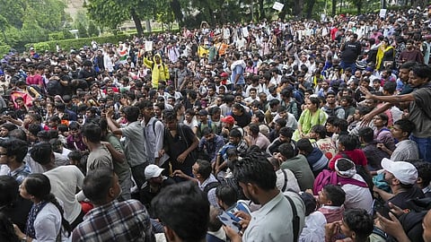 Cockroach Janata Party (CJP) supporters raise slogans, near Jantar Mantar ahead of a protest march, in New Delhi, early Monday, July 20, 2026