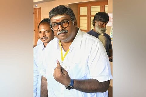 The ruling All India N.R. Congress (AINRC) candidate for Thattanchavady bypoll, Ashok Anand shows the indelible ink mark after casting his vote at a polling booth in Thattanchavady in Puducherry on October 6, 2026
