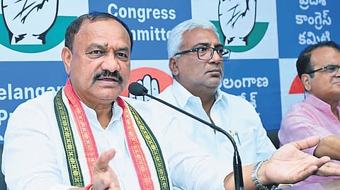 TPCC chief B Mahesh Kumar Goud addresses the media at Gandhi Bhavan in Hyderabad on Friday.