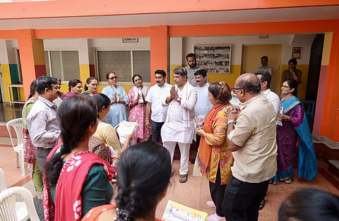 LoP in Assembly R Ashoka campaigns at a school seeking votes for NDA candidate 
AP Ranganath ahead of the Bengaluru Teachers’ constituency polls, on Friday.
