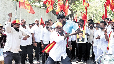 Supporters celebrate TVK’s victory in the bypolls outside the party headquarters in Chennai on Friday. 