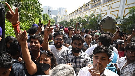 Protesters raise slogans inside Bangla Sahib Gurudwara during a protest against Chief Election Commissioner Gyanesh Kumar in New Delhi on Saturday