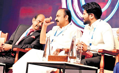 Lulu Group chairman Yusuffali M A, Chief Minister V D Satheesan and actor Dulquer Salmaan at the valedictory ceremony of c0c0n 2026 conference in Kochi 