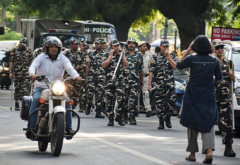 Security personnel keep vigil as part of heightened security arrangements by Delhi Police ahead of a proposed protest by the Cockroach Janta Party (CJP), in New Delhi, Friday, Oct. 9, 2026. Delhi Police have heightened security across Lutyens' Delhi, deploying extra force and enforcing Section 163 of the BNSS prohibiting unlawful gatherings. 