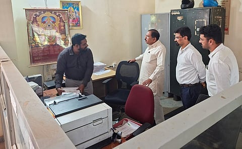 Deputy Chief Minister and Revenue Minister G Parameshwara on Friday suspended an official for negligence in maintaining revenue records during a surprise inspection of the Devanahalli taluk office. 